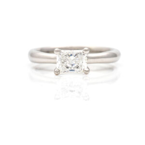 claw setting on an emerald-cut diamond ring