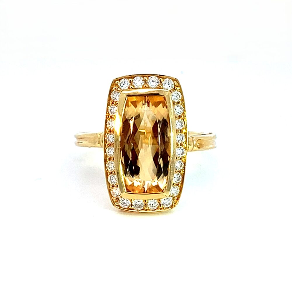 An Imperial Topaz and Diamond Dress Ring