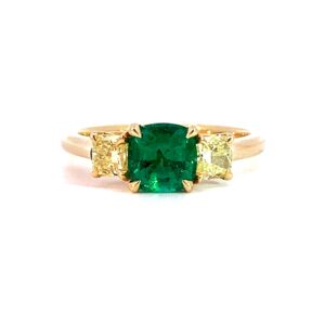 An Emerald and Yellow Diamond Three Stone Ring
