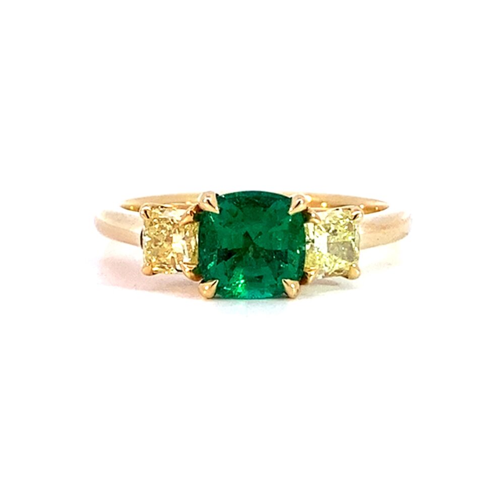 An Emerald and Yellow Diamond Three Stone Ring